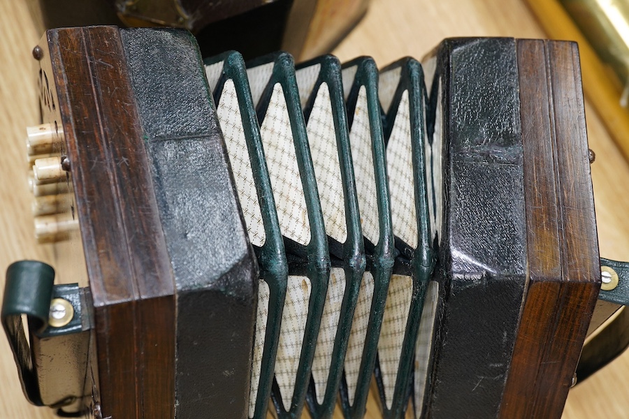 A leather cased mid-19th century Lachenal, London, 23 button concertina. Condition - fair to good, some wear to the case. The bellows appear sound and strong.